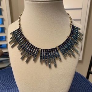 Goldtone Bib Necklace with Teal and White Stones